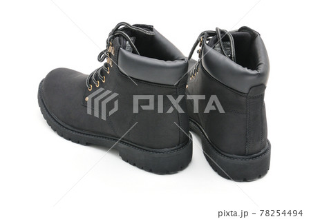 Suede boots with thick soles on a white background Suede boots with thick soles on a white background 78254494