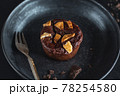 Chocolate muffin with fork served on table 78254580