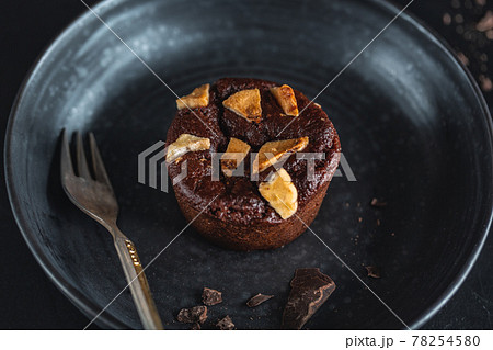 Chocolate muffin with fork served on table 78254580