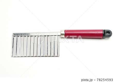 Wavy knife for slicing french fries, vegetable chips and fruits on a white background Wavy knife for slicing french fries, vegetable chips and fruits on a white background 78254593