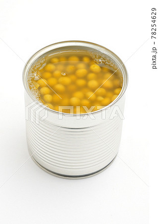 Metal tin can with green peas on a white background 78254629