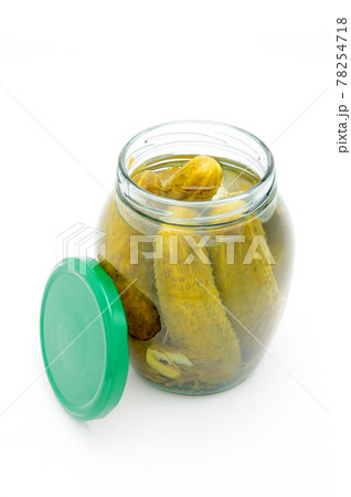 Pickled cucumbers in a glass jar on a white background 78254718