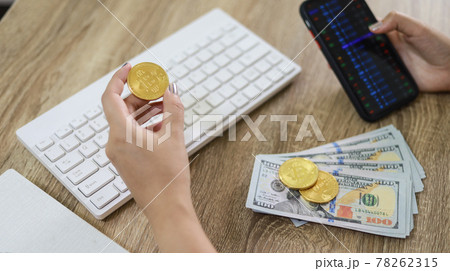 Cryptocurrency symbol bitcoin. Gold Digital Currency Money Investing in virtual assets. Hand hold Golden bitcoin Investment market trend financial world cryptocurrency and technology Cryptocurrency symbol bitcoin. Gold Digital Currency Money Investing in virtual assets. Hand hold Golden bitcoin Investment market trend financial world cryptocurrency and technology 78262315