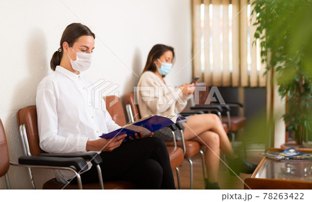 Woman in face mask waiting for job interview Woman in face mask waiting for job interview 78263422