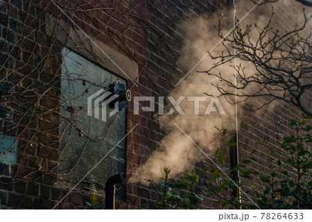 smoke from stove metalic pipe, Behind the house. 78264633