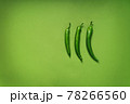 green monochrome with three green peppers on a background 78266560