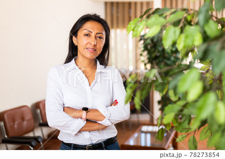 Portrait of positive female manager in office Portrait of positive female manager in office 78273854