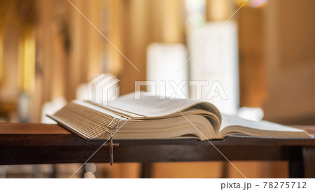 The opened Bible on altar in the public church. The opened Bible on altar in the public church. 78275712