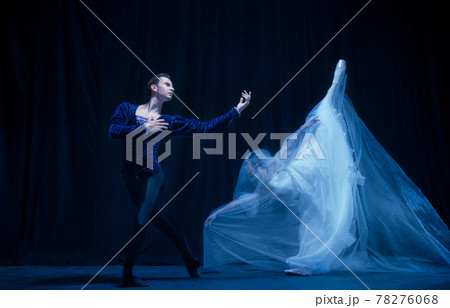 Graceful balerina in image of ghost bride with patner in art ballet performance isolated over dark background. Graceful balerina in image of ghost bride with patner in art ballet performance isolated over dark background. 78276068