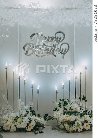 Happy Birthday party decoration the photo zone on a beige background. Festive background decoration for birthday celebration. Selective focus 78281023