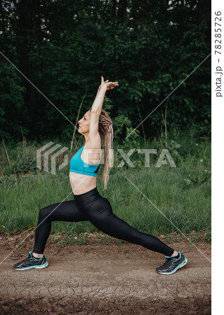 Woman in sportswear training in morning nature. Woman in sportswear training in morning nature. 78285726