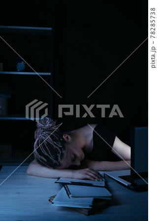 Businesswoman fell asleep near laptop, night work Businesswoman fell asleep near laptop, night work 78285738
