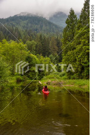 Adventure Caucasian Adult Woman Kayaking in Red Kayak 78286606