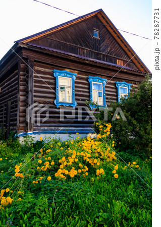 Old wooden log house in a russian village 78287731