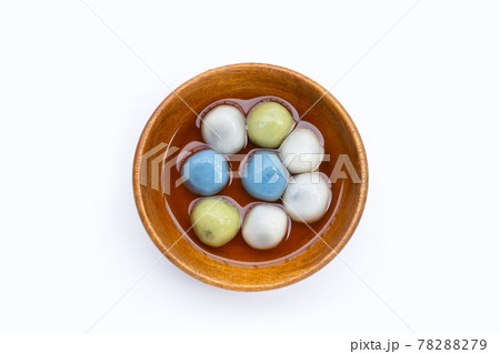 Black sesame dumpling in ginger tea recipes in wooden bowl on white background. 78288279