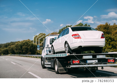Car Service Transportation Concept. Tow Truck Transporting Car Or Help On Road Transports Wrecker Broken Car. Auto Towing, Tow Truck For Transportation Faults And Emergency Cars . Tow Truck Moving In Car Service Transportation Concept. Tow Truck Transporting Car Or Help On Road Transports Wrecker Broken Car. Auto Towing, Tow Truck For Transportation Faults And Emergency Cars . Tow Truck Moving In 78288353