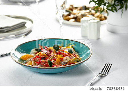 Fish fillet ceviche, fresh-marinated fish in citrus juice with fresh vegetables and orange slices, marinated sea bass Fish fillet ceviche, fresh-marinated fish in citrus juice with fresh vegetables and orange slices, marinated sea bass 78288481