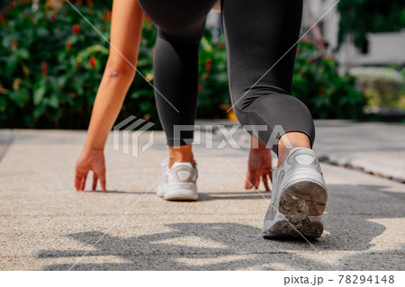 Asian sport girl doing stretching, yoga fitness and plank exercise outside. Fit young thai woman 78294148