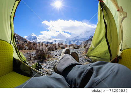Hiker enjoy the beautiful landscape in tent Hiker enjoy the beautiful landscape in tent 78296682