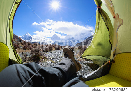 Two hikers enjoy the beautiful landscape in tent 78296683