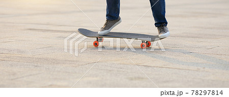 Skateboarder legs skateboarding at outdoors 78297814