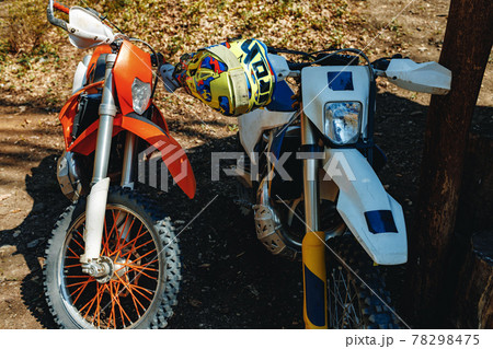 Close-up details of cross motorcycle parked on ground 78298475