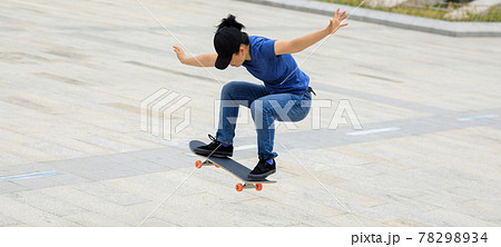Skateboarder skateboarding outdoors in the morning 78298934