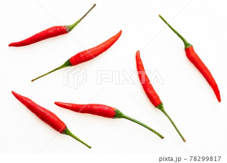 Top view some of the red chili or Jinda Chili in Thai language, close up image, arranged fresh chili as a pattern on white background. Top view some of the red chili or Jinda Chili in Thai language, close up image, arranged fresh chili as a pattern on white background. 78299817