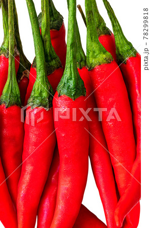 Close up stack of fresh red chilli, isolated on white background. Vertical image of red chilli. Close up stack of fresh red chilli, isolated on white background. Vertical image of red chilli. 78299818