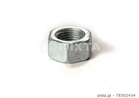 the metal nut lies isolated on a white background the metal nut lies isolated on a white background 78302434