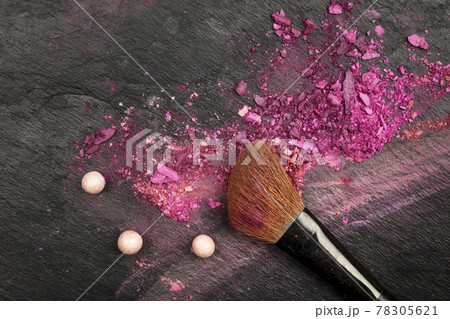 Closeup of makeup brush with eye shadows on black with copy space Closeup of makeup brush with eye shadows on black with copy space 78305621