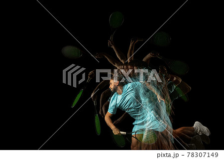 One man, professional tennis player isolated on black background in mixed neon light. Stroboscope One man, professional tennis player isolated on black background in mixed neon light. Stroboscope 78307149