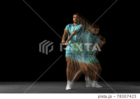 Stroboscope effect. One man, professional tennis player isolated on black background in mixed neon light. 78307425