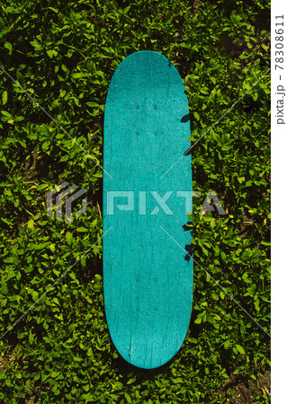 Green wooden skateboard. Skateboarding background, street sport. Green wooden skateboard. Skateboarding background, street sport. 78308611