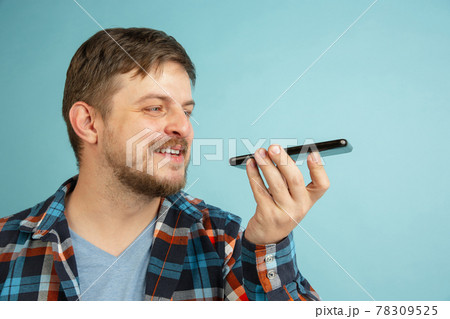 Young happy Caucasian bearded man in casual clothes isolated on light blue background. Young happy Caucasian bearded man in casual clothes isolated on light blue background. 78309525
