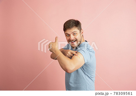 Half-length portrait of young Caucasian man isolated on light pink background. Vaccination, healthy life concept Half-length portrait of young Caucasian man isolated on light pink background. Vaccination, healthy life concept 78309561