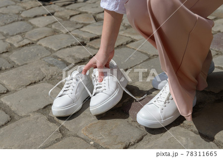 New and old white sneaker shoes . contrast, comparison, different, new and old, good and bad, clean and dirty concept. New and old white sneaker shoes . contrast, comparison, different, new and old, good and bad, clean and dirty concept. 78311665