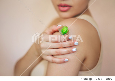Crop woman with ice cubes for skincare routine Crop woman with ice cubes for skincare routine 78311805