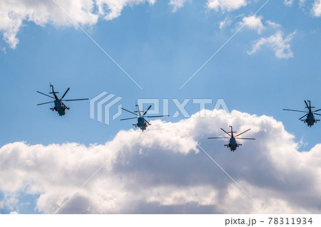 Moscow, Russia - May, 05, 2021: MI-8 multipurpose helicopters fly over Red Square during the General rehearsal of the parade celebrating Victory Day in Moscow. Moscow, Russia - May, 05, 2021: MI-8 multipurpose helicopters fly over Red Square during the General rehearsal of the parade celebrating Victory Day in Moscow. 78311934