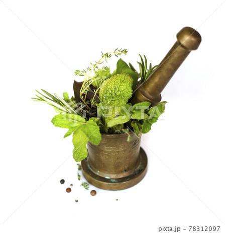 Herbs and pestle in mortar Herbs and pestle in mortar 78312097