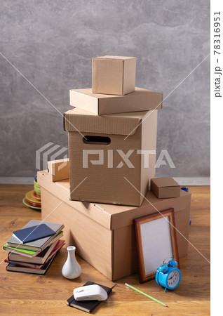 Cardboard boxes and things for moving to new home. Stack of cardboard box on floor background. 78316951