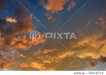 Colorful altocumulus clouds on blue sky background with sunrise. Colorful altocumulus clouds on blue sky background with sunrise. 78318719