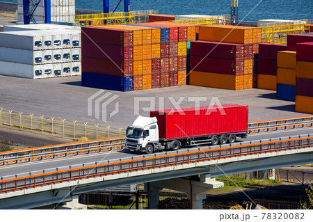 container ship truck auto transportation of containers on the highway bridge in the background a seaport with a warehouse of containers yard exported by sea, logistics services by different vehicles. container ship truck auto transportation of containers on the highway bridge in the background a seaport with a warehouse of containers yard exported by sea, logistics services by different vehicles. 78320082