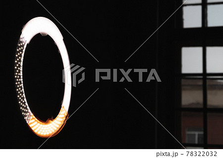 Circular LED light glowing in dark studio Circular LED light glowing in dark studio 78322032
