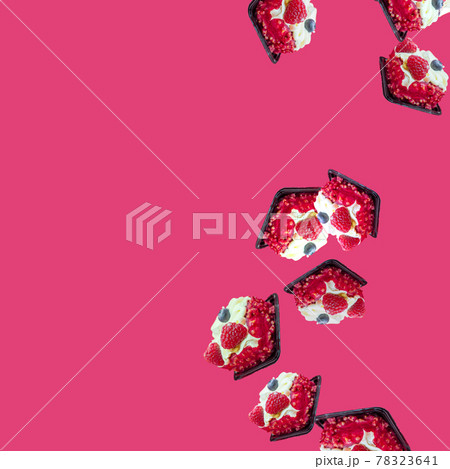 cakes fall from top to bottom on the right on the pink-fucshia background. Space for text and advertising. Summer sweet flat flay with copy space cakes fall from top to bottom on the right on the pink-fucshia background. Space for text and advertising. Summer sweet flat flay with copy space 78323641