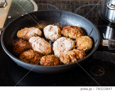 many russian Kotleta (minced beef steaks) in pan many russian Kotleta (minced beef steaks) in pan 78323847