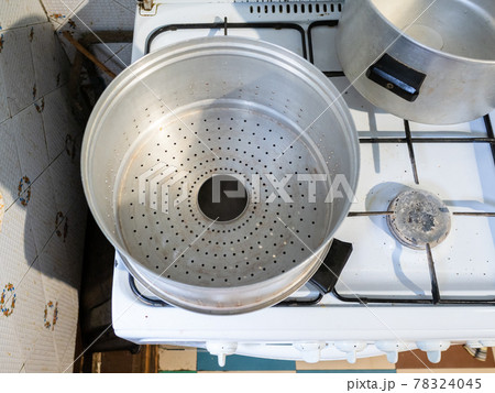view of empty metal steamer pot for Manti cooking 78324045