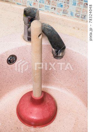 common plunger in used kitchen sink common plunger in used kitchen sink 78324048