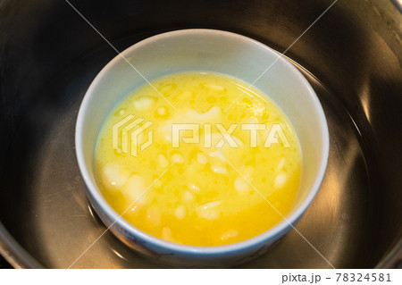melted butter in bowl in water bath 78324581