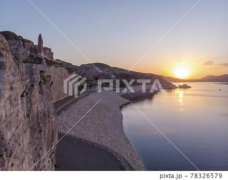 Aerial Drone Shot at sunset Time on the Tigres River in Eastern Turkey, Mesopotamia, the ancient city of Hasankeyf, caves in the rock 78326579